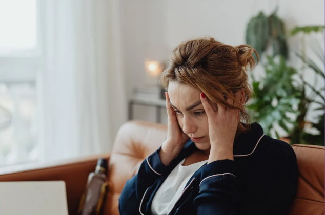Person feeling overwhelmed by a busy schedule and daily responsibilities